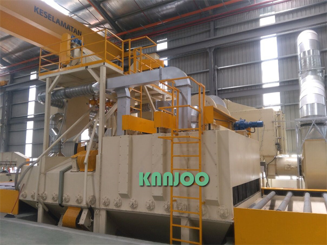 The shot blasting machine for steel plates manufactured for Mitsubishi Heavy Industries is admired b